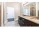 Bathroom with double vanity, granite countertops, and a glass-enclosed shower at 745 Fountainhead Ne Ln # 112, Atlanta, GA 30324