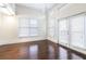 Living room with vaulted ceilings, skylights, and hardwood floors, illuminated by natural light at 745 Fountainhead Ne Ln # 112, Atlanta, GA 30324