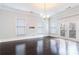 Bright living room with hardwood floors, large windows, and a door to a balcony at 745 Fountainhead Ne Ln # 112, Atlanta, GA 30324