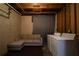 Unfinished basement featuring a couch and laundry equipment at 1102 Wedgewood Way, Atlanta, GA 30350