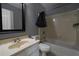 Bathroom featuring a vanity, mirror, toilet, and a shower-tub combination at 1102 Wedgewood Way, Atlanta, GA 30350