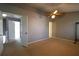 Bright bedroom with neutral walls, ceiling fan, and access to another room at 1102 Wedgewood Way, Atlanta, GA 30350