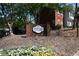 Dunwoody Plantation community sign surrounded by colorful flowers and lush greenery creates a welcoming entrance at 1102 Wedgewood Way, Atlanta, GA 30350