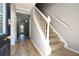 Inviting foyer with wood floors and staircase leading to the upper level, offering a warm welcome at 1102 Wedgewood Way, Atlanta, GA 30350