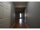 Hallway leading to a room featuring wood flooring and a glass door at 1102 Wedgewood Way, Atlanta, GA 30350