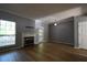 Bright living room with hardwood floors, a fireplace, and ample space for furnishings, creating a warm atmosphere at 1102 Wedgewood Way, Atlanta, GA 30350