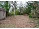 Large backyard offering lots of space for activities, gardening, and room to entertain at 1395 Winburn Dr, East Point, GA 30344