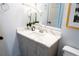 Bathroom featuring a modern vanity with a light countertop and a decorative mirror at 1395 Winburn Dr, East Point, GA 30344