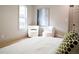 Bright bedroom with hardwood floors, comfortable decor, and natural light at 1395 Winburn Dr, East Point, GA 30344