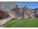 Charming brick home featuring a manicured lawn, covered parking, and classic architectural details at 1395 Winburn Dr, East Point, GA 30344