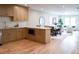 Kitchen blends to dining/living areas, featuring stone countertops and microwave at 1395 Winburn Dr, East Point, GA 30344