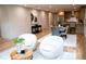 Open-concept living space with modern furniture and a view into the kitchen and dining area at 1395 Winburn Dr, East Point, GA 30344