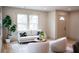 Cozy living room with neutral tones, modern furniture, and large windows for natural light at 1395 Winburn Dr, East Point, GA 30344