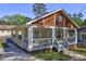 Quaint home showcasing a covered front porch and meticulously kept lawn at 2264 Pryor Rd, Atlanta, GA 30315