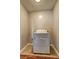 This laundry room has tile floors and a modern washing machine against a freshly painted wall at 2264 Pryor Rd, Atlanta, GA 30315