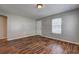 Open Living room featuring hardwood floors and bright gray walls at 2264 Pryor Rd, Atlanta, GA 30315