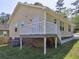 A back exterior featuring a deck and a yard with grassy lawn at 2264 Pryor Rd, Atlanta, GA 30315