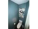 Powder room featuring blue walls and decorative wall art at 2499 Sinclair Trce, Powder Springs, GA 30127
