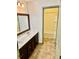 Spacious bathroom featuring double vanity and bathtub shower at 2499 Sinclair Trce, Powder Springs, GA 30127