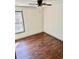 Bright bedroom with hardwood floors and a ceiling fan at 2499 Sinclair Trce, Powder Springs, GA 30127
