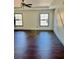 Bedroom with hardwood floors, ceiling fan, and sunlit windows at 2499 Sinclair Trce, Powder Springs, GA 30127