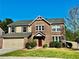 Inviting two-story brick home featuring a well-manicured lawn and attached two-car garage at 2499 Sinclair Trce, Powder Springs, GA 30127