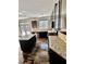 Well-appointed kitchen with dark cabinets, granite countertops, stainless appliances, and hardwood floors at 2499 Sinclair Trce, Powder Springs, GA 30127
