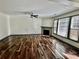 Spacious living room boasting hardwood floors, a ceiling fan, a fireplace, and natural light at 2499 Sinclair Trce, Powder Springs, GA 30127