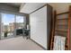 Flex bedroom featuring hidden murphy bed, attached desk space, balcony access and bright cityscape views at 943 Peachtree Ne St # 1910, Atlanta, GA 30309