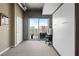Flex bedroom featuring hidden murphy bed, attached desk space, balcony access and bright cityscape views at 943 Peachtree Ne St # 1910, Atlanta, GA 30309