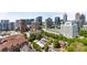 Excellent aerial view of city buildings, mature trees and rooftops of varying heights at 943 Peachtree Ne St # 1910, Atlanta, GA 30309