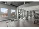 Well-equipped gym with modern weightlifting machines, fitness equipment, and bright windows at 943 Peachtree Ne St # 1910, Atlanta, GA 30309
