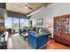 Inviting living room with comfortable seating, exposed ductwork, and city views at 943 Peachtree Ne St # 1910, Atlanta, GA 30309