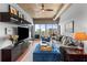 Inviting living room with modern decor, floor to ceiling windows, and city views at 943 Peachtree Ne St # 1910, Atlanta, GA 30309