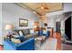 Open-concept living room with modern furniture and an open view of the kitchen at 943 Peachtree Ne St # 1910, Atlanta, GA 30309