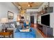 Open-concept living room with modern furniture and an open view of the kitchen at 943 Peachtree Ne St # 1910, Atlanta, GA 30309