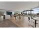 Spacious community lounge area with long bar, tables and chairs and TV watching area at 943 Peachtree Ne St # 1910, Atlanta, GA 30309