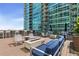 Modern outdoor lounge with comfortable seating, a fire pit, and scenic views at 943 Peachtree Ne St # 1910, Atlanta, GA 30309