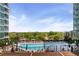 Community pool surrounded by trees and greenery, offering a relaxing oasis at 943 Peachtree Ne St # 1910, Atlanta, GA 30309
