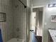 This bathroom showcases a tiled shower, recessed storage, and modern fixtures at 1276 Seattle Slew Ln, Norcross, GA 30093