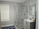 Modern bathroom featuring an enclosed glass shower and stylish vanity at 1276 Seattle Slew Ln, Norcross, GA 30093