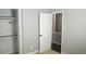 This bedroom showcases a closet with open doors and neutral carpeting at 1276 Seattle Slew Ln, Norcross, GA 30093