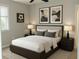 This cozy bedroom is furnished with a large bed and matching nightstands at 1276 Seattle Slew Ln, Norcross, GA 30093