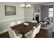 Bright dining room with a modern chandelier, sleek table, and comfortable seating at 1276 Seattle Slew Ln, Norcross, GA 30093