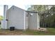 Exterior view of two-story home with trees and grassy backyard at 1276 Seattle Slew Ln, Norcross, GA 30093