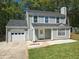 Charming two-story home with light green siding, a well-manicured lawn, and attached garage for modern living at 1276 Seattle Slew Ln, Norcross, GA 30093