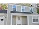 Two story home featuring an exterior paint job, with a white door, gutters and trim at 1276 Seattle Slew Ln, Norcross, GA 30093