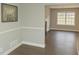 Comfortable sitting room with a window, painting and hardwood floors at 1276 Seattle Slew Ln, Norcross, GA 30093