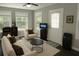 Inviting living room featuring ample natural light, neutral decor, comfortable seating, and modern fixtures at 1276 Seattle Slew Ln, Norcross, GA 30093