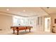 Spacious finished basement boasts a pool table and built-in shelving, great for recreation at 1418 Waterford Green Dr, Marietta, GA 30068